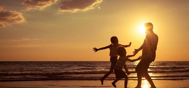 Father and kids at the beach